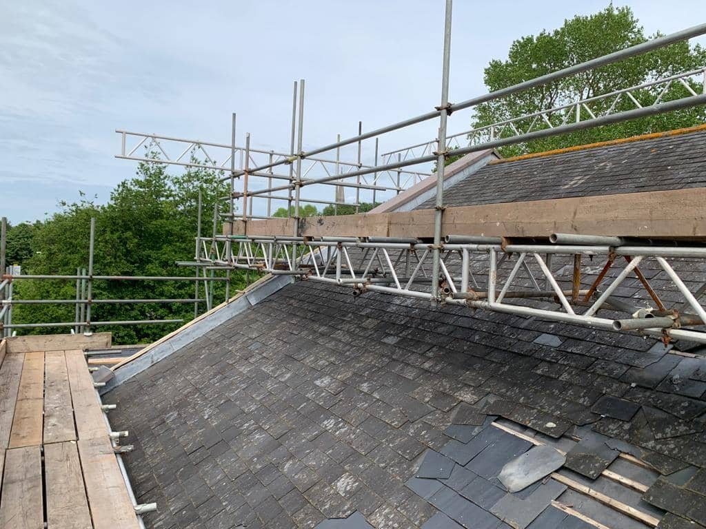 Roof tile repair work on UK home